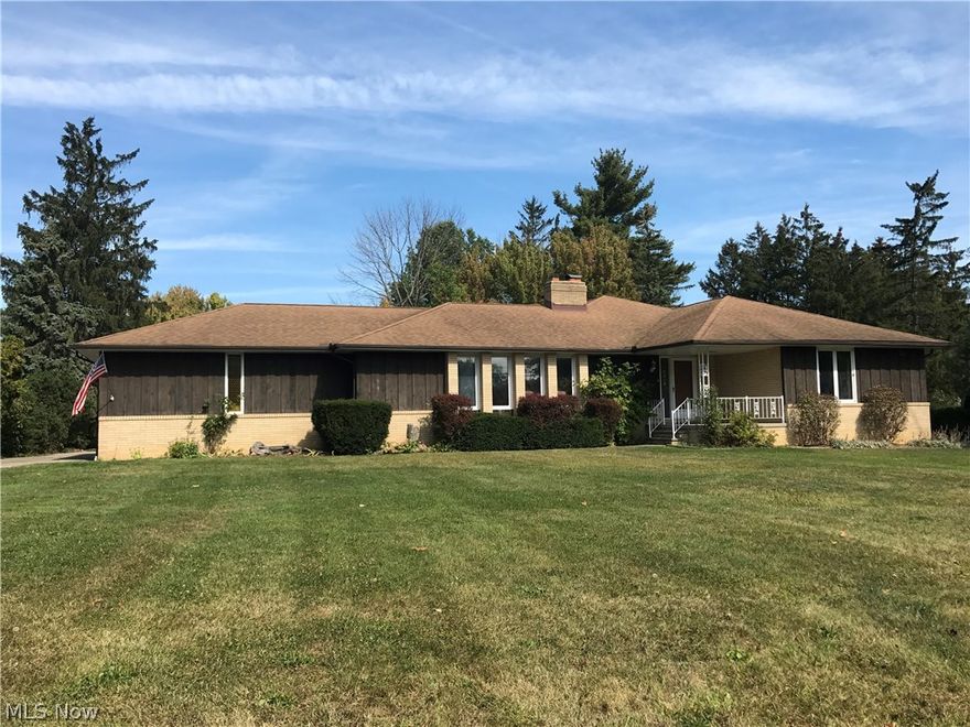Sprawling ranch with over 2700 SF*Foyer entrance leads to a Living/Dining Room with woodburning fireplace*Kitchen has espresso stained cabinets, newer SS appliances, pantry & overlooks the large Family Room with view of 2 sided fireplace & step down area with vaulted ceiling & a wet bar with curved & built-in refrigerator*sliding door to huge covered deck overlooking decorative pond with waterfall & deep back yard with a shed*Family Room & Master Bedroom were a newer addition*Master BR has vaulted ceiling, sliding door to deck, huge walk-in closet, dressing with mirrors and leads to the Master Bath with double vanity sinks, huge whirlpool tub & separate shower*2 additional Bedrooms, one with private bath & walk-in closet*Another full Bath is off the main hall*1st floor Laundry plumbing could be converted back*Half bath*Lower level has a rec room & plenty of storage area*Crawl space under bedrooms in original house and under newer addition*Recently updated both electric boxes*Newer boil