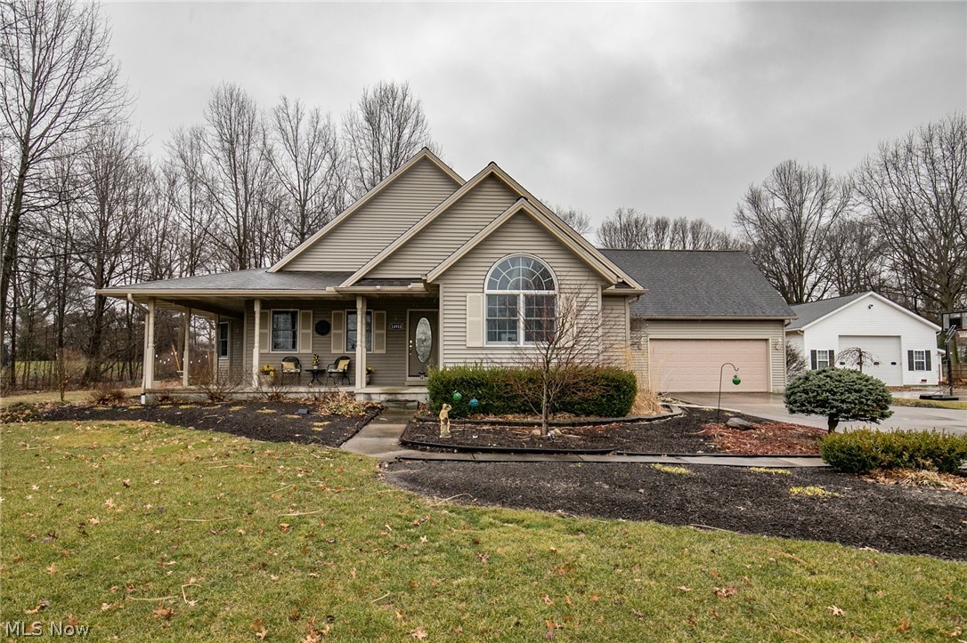 This amazing 3 bedroom, 2 full bath Ranch nestled on 1.21 acres is sure to please! The attractive exterior showcases lush landscaping, wrap around front porch, expansive driveway & oversized 2.5 car garage w/ pull down attic, hot/cold water & drain. The charming front porch leads you to the inviting foyer, opening to the vaulted family room highlighted by crown molding, white pillars, refaced gas fireplace(2018) w/ blower, built-in shelving & solar tubes. The bright sunroom/dining space boasts a wall of windows, trey ceiling, crown molding & doors out to the wrap around porch & enclosed 3 season room! Cooking your favorite meals will be a delight in the updated eat-in kitchen(2019) w/ gorgeous granite countertops, beautiful backsplash, sprawling center island w/ seating, Kraftmaid cabinetry w/ pull out shelving & trash can cabinet, bayed dining area & stainless steel appliances. Relaxing master bedroom w/ walk-in closet, 2nd closet & en suite bath w/ jetted tub, walk-in shower & granit