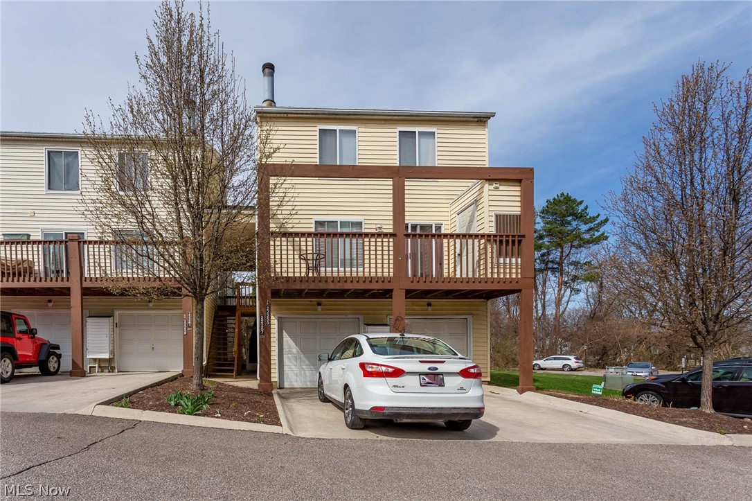 Large, updated three bedroom, two and a half bathroom townhome in the very desirable Rocky River community! This end unit at the back of the River Walk complex offers privacy, access to additional green space, and ample parking. Home offers three floors of spacious living, including a third floor master suite with a private balcony, en suite, including a soaker tub, and a walk in closet. The second floor offers two bedrooms, full bath, and laundry! The main floor includes a large living room with a wood burning fireplace, updated kitchen, access to the a large private patio with wooded views, a half bath, and access to one car garage. Schedule your showing today!