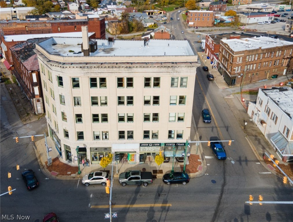 Fantastic Business Opportunity across from the Diamond Historic District! This large building housed many things over the years. Most recently it would have had 6 Individual Retail Spaces for Renting on the First Floor. This Building has 5 Levels Above Ground and a Full Basement as well. Each floor has 14' Ceilings, including the basement. WOW! The Second Floor has 14 Individual Office Spaces, the Third Floor has 14 Individual Office Spaces, the Fourth Floor has 13 Rooms, and the Fifth Floor has 12 Rooms. The Upper Levels have AMAZING views of the City & Scenery. There are Restrooms on every Floor at the top of each Staircase. The Floors are all Terrazzo type floor on Floors 2-5. The Ground Level has Commercial Laminate Floors in all 6 Units. A Full Basement allows each Unit plenty of Space for Storage. There is an Elevator in the Building. The Building is a VERY Solid Structure with TONS of Original Woodwork, Character, & Charm still remaining. Various Updates have been made to the First Floor. There is also a Large Parking Lot Adjacent to the Building that will Sell the Building that can hold approximately 20-30 Cars.