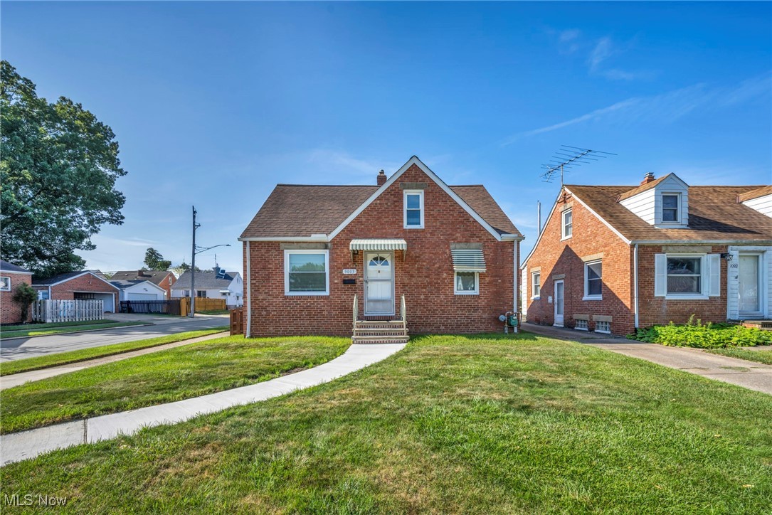 Welcome to this beautifully updated Cape Cod Home nestled in the heart of Brooklyn, Ohio! Located on a desirable corner lot in the charming Memphis Villas subdivision, this move-in-ready 3-bedroom home offers the perfect blend of character, comfort, and convenience. With nearly 2,000 total finished square feet, this home features a spacious layout that includes 3 bedrooms, 1 full bath, and a partially finished Basement with a bonus recreation space. The first floor offers two generously sized bedrooms, a full bath, and a bright and inviting living room with large windows and new carpeting. The updated kitchen includes an eat-in area, recessed lighting, and all appliances—microwave, range, and refrigerator—convey with the sale. The oversized second-floor primary bedroom spans nearly 28 feet and features built-in storage space and dual flooring options, perfect for customizing to your style. Downstairs, the finished basement adds over 700 additional square feet of living and entertaining space, including a recreation room, laundry area with utility sink, laundry chute, and ample storage space. Additional updates include new carpet throughout, modern fixtures, and energy-efficient windows. Enjoy morning coffee on the covered front porch or entertain on the rear patio in the fenced backyard. The 1-car detached garage with electric and side-facing access adds privacy and functionality. Located on a quiet, sidewalk-lined street near parks, schools, shopping, and highways, this home combines suburban tranquility with urban convenience. Enjoy city lights views, thoughtful landscaping, and the peace of mind that comes from a home that has been well maintained and tastefully updated. With forced air heat, central air, and ceiling fans for comfort, this home is ready for immediate occupancy. Don’t miss your opportunity to own this stylish, affordable gem in a friendly, established neighborhood. Schedule your private showing today!