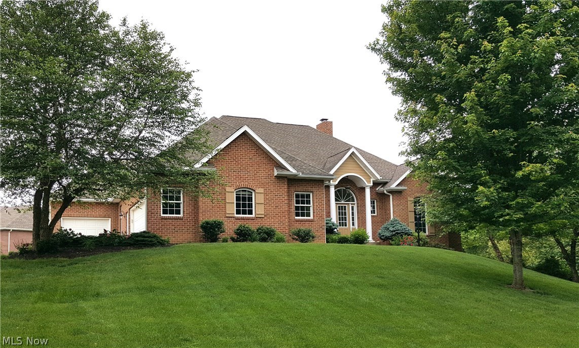 Rare find! This wonderful home offers 4/5 bedrooms, 3.5 bathrooms in East Muskingum School District along with a full size theater room, finished basement with a wet bar, formal dining room and large outdoor patio, just to name a few features.. Great for entertaining, this home has enough space and a great open yet still cozy floor plan for everyone to enjoy. You will be blown away by the 9 & 10 ft ceilings, wooded views from on top of the hill, and gorgeous hardwood floors. The master suite has an amazing walk in closet, along with the good sized utility closet in basement and a 3 car garage this home has plenty of storage space as well. Call me today for a private showing.