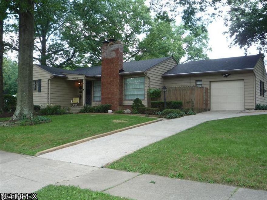 Nice three bedroom, 1.5 bath ranch on corner lot has just been freshened up to make it ready to move into.  All wallpaper has been stripped,  walls & ceilings freshly painted with neutral tones.  Hardwood floors everywhere except the eat-in kitchen, mostly newer windows and newer roof.  Living room has fireplace and wall of windows, formal dining room has exterior door that leads to private deck, bathroom is in very nice condition with new vanity and kitchen comes with all appliances.  Attached garage, very nice size side yard.  Home Warranty