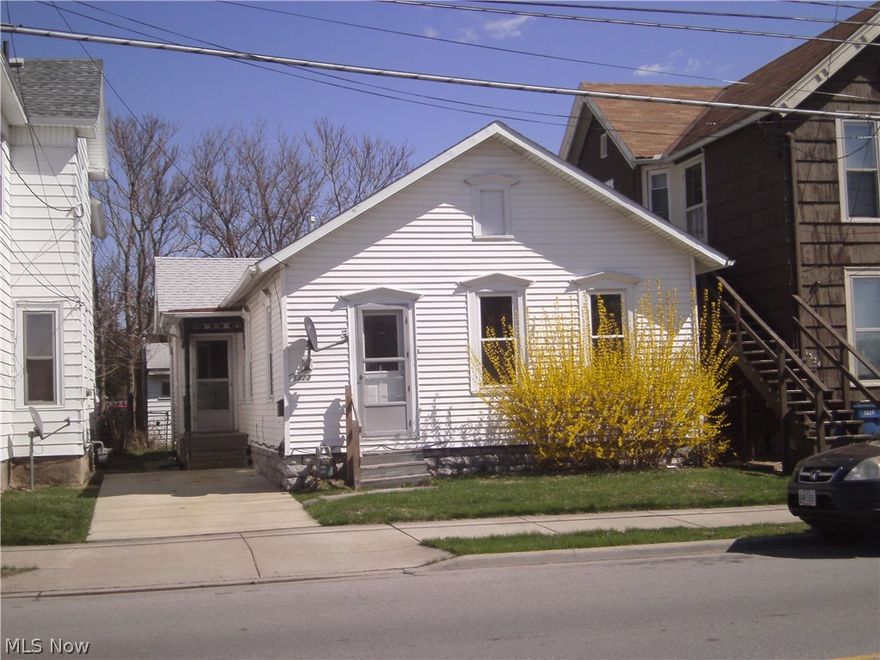 AFFORDABLE!! Are you looking for a wonderful first home in Sandusky Possibly an investor wishing to start or add another property in their portfolio. Centrally located close to everything Sandusky has to offer. Downtown, shopping, schools and the hospital. Featuring two bedrooms and 1 1/2 baths. Maintenance free and move in ready. Many new updates including carpeting, laminated flooring, painting, with a newer roof and replacement windows. The open floor plan is sure to please. The kitchen has plenty of counter space, cabinets and sitting area. The middle dining room area can be used as a family room. It is you decision. Plenty of storage in the basement, attic, and the garage. The attic can be converted into more living space. The garage could be transformed into a man cave if desired. Ask about the city of Sandusky's down payment assistance program! This home is priced to sell and is sold "as is".  This one will not last long!