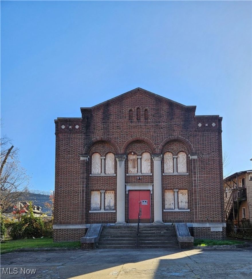 An unparalleled investment opportunity in the heart of Steubenville! This stately, century old brick church offers a commanding presence and timeless architectural character, ripe for visionary redevelopment. Picture yourself capitalizing on the soaring cathedral ceilings, dramatic nine foot stained glass windows, and an abundance of natural light that floods the expansive sanctuary. Its impressive scale and open layout present a unique canvas for lucrative future uses, from high end residential conversion and a dynamic creative studio to a sought-after event venue or a striking business showroom.

The main foyer grants access to a front balcony and a versatile basement. Inside, a magnificent 22 foot oak feature wall sets the tone. Five distinct office spaces and a central walk-in closet provide immediate functionality, complemented by two generous balconies overlooking the main hall.

The full basement is a goldmine of potential, featuring a kitchen, space for two bathrooms, a second walk-in coat closet, and a stage area perfect for maximizing rental income or creating distinct living/working zones. A recently repaired roof ensures structural integrity, while a separate utility room and deep cellar add further value. Direct access from the basement leads to five convenient parking spaces in the rear lot. Located in a rapidly revitalizing area, this property is perfectly positioned for savvy investors looking to restore and reimagine an iconic structure. Seize this one of a kind opportunity to create value and write a new chapter for a beloved landmark. The potential is limitless, come discover it today!