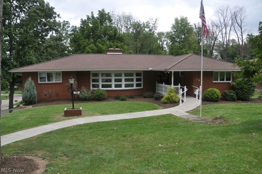 Very nice brick ranch home offering nice size living room with decorative fireplace, kitchen open to dining area, large first floor family room, sun porch off kitchen, three bedrooms and two full baths, including master bed and bath with three closets. Full basement with laundry room, shower, commode and sink plus utility sink, plus lots of storage space and two car garage with workshop.  Owner has just had the interior freshly painted, new carpet in living room, home has been gone over for electrical, plumbing, etc., plus fresh landscaping and exterior trim paint.