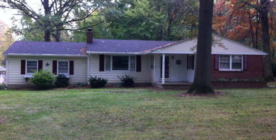 Great Ranch Home in Canfield Schools on a private one acre lot.  Three bedrooms with a Master 1/2 bath and double closets, all hardwood floors.   The spacious Living Room has a wood burning fireplace, built-ins and potentially hardwood floors underneath the carpet.  The Eat-in Kitchen comes equipped with an awesome Jenn-Air gas Dual Fuel Stove Convection Oven, with an additional built-in cook top.  New Roof in 2013, New Septic System, updated Plumbing, French Drains and Sump Pump in 2005 and updated Electric and New furnace in 2004.  This Basement has a great Family Room with a gas fireplace and built-ins, a Recreation Room, Workbench, Laundry Room, a shower and plenty of storage.  The Sun room overlooks the huge private backyard.    Single car attached garage and a two car detached.