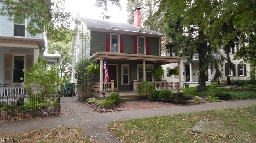 A rare find, this historic home on 5th Street in Marietta is in fabulous condition offering all of the charm of the homes of yesteryear AND incredible energy efficiency. The expansive kitchen/informal dining area is equipped with plenty of updated cabinetry and a center island with a granite top. The gracious formal living room and dining room have attractive hardwood flooring, high ceilings and fireplaces. The master suite is huge and offers a sitting area in the bedroom and bathroom with plenty of space. Two large decks with a great view of the city, are located at the rear of the home as well as a paver brick patio with a fire pit. A great place for entertaining! Solar panels reduce the electric bill to next to nothing! There are 4 bedrooms and 2 1/2 baths above grade. The basement is finished into 1 bedroom,  1 bathroom separate apartment that has been renting for $750.00 per month plus electric. There is a new 2-story garage with alley access and a huge shop on the second floor wi