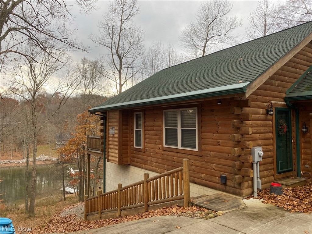 Wonderful Lakefront Log Home with paved drive and wooded surroundings.no drywall. Built by Walnut Valley Log Homes.