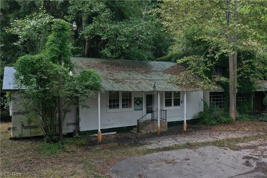 Nestled on approximately 9.47 acres of rural land, this property presents a unique opportunity for renovation enthusiasts. While the main home requires work, its solid foundation promises a rewarding transformation. Benefit from an attached two-car garage, city water, septic with a monitor, electric, and natural gas. Reside in the attached bar, which requires minimal touch-ups, as you oversee the main home's complete remodel. The vast acreage teems with white-tail deer, perfect for hunting aficionados. Located in Calhoun County, enjoy the freedom of no building codes or restrictions. The home is safely away from a 100-year floodplain and offers easy county road access, ensuring both seclusion and accessibility. Dive into this renovation project and relish the beauty of nature.