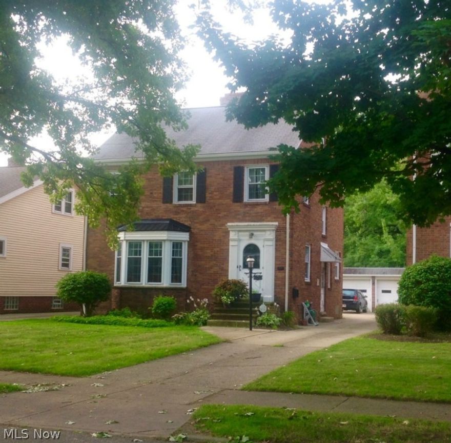 Classic West Park (Kamm's Corners) brick colonial in a family-friendly neighborhood. Spacious living room, dining room and master bedroom, built-in nooks, bookshelves and china cabinet, picturesque doorway arches and refinished hardwood floors throughout. Two (2) additional bedrooms and opportunity for another full size bedroom on third floor. Two (2) beautiful working fireplaces. Large basement with multiple rooms. Also features a back porch and balcony overlooking the backyard. Kitchen floors refinished in May 2015. Fenced-in backyard abuts wooded community park. Garage is larger and deeper than normal two-car garage. Newer windows. Appliances will remain including refrigerator, washer and dryer. This house has plenty of storage space and large closets.
