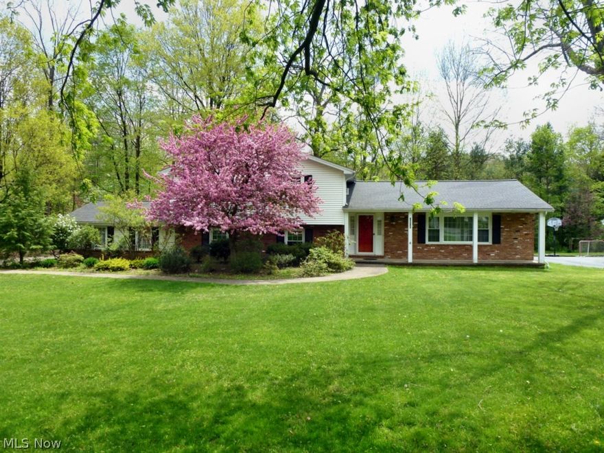 This 4 level split offers many extras! A front porch leads you to the foyer and Formal Living Room that opens into the Formal Dining Room. Wait 'til you see the Beamed and Vaulted Ceiling 3 Season Room off the 8' sliding door in the Dining Room! Many recent improvements include the windows and a new boiler. You'll find Hardwood Floors (under carpet) in all bedrooms and an Eat-in Kitchen with a Tile Floor.  Located just a few hundred feet from the Recreation Area Meadow and Lake with Tennis Courts across the driveway and the Ball Field across the street it is a prime location in the Lake Lucerne neighborhood....and with a 1/2 Acre lot! You can't help but LOVE the 24' x 20' Deck and adjacent 21' x 16' Brick Patio that is easily accessed from the Family Room or the 3 Season Room. STORAGE GALORE in the basement with built in shelving and extra closets in the Laundry area as you enter from the garage.  Best value in Lake Lucerne-check it out!