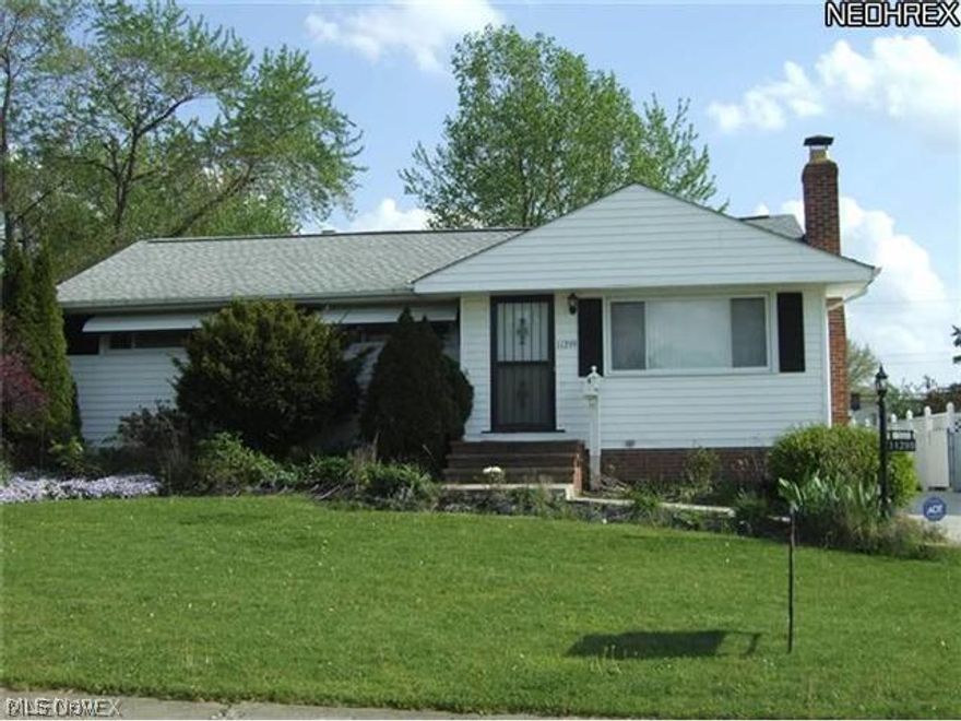 This delightful Parma ranch waits for you!   An updated kitchen with ceramic flooring, maple cabinets, counter and breakfast bar finished in 2010.   Living room has laminate floors and fireplace.   Slider off dining room leads to the upper deck.  Three season room with sky lights and view of nice fenced back yard.  A 2- car garage plus carport.  Huge finished rec room, summer kitchen and full bath complete the home.  Roof 5 years, driveway 3 years, furnace and central air 7 years, windows 8 years.