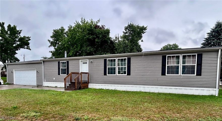 This spacious double wide mobile home offers 3 bedrooms and  2 baths .  The open floor plan has a kitchen featuring updated cabinets and countertops and a central island prefect for cooking or gathering.  Enjoy a nicely updated master bath and relax on your patio with a beautiful view.  A news shed adds extra storage and the home is set in a peaceful location Affordable and move in ready.,  Don't miss it.   Subject to seller finding suitable housing.