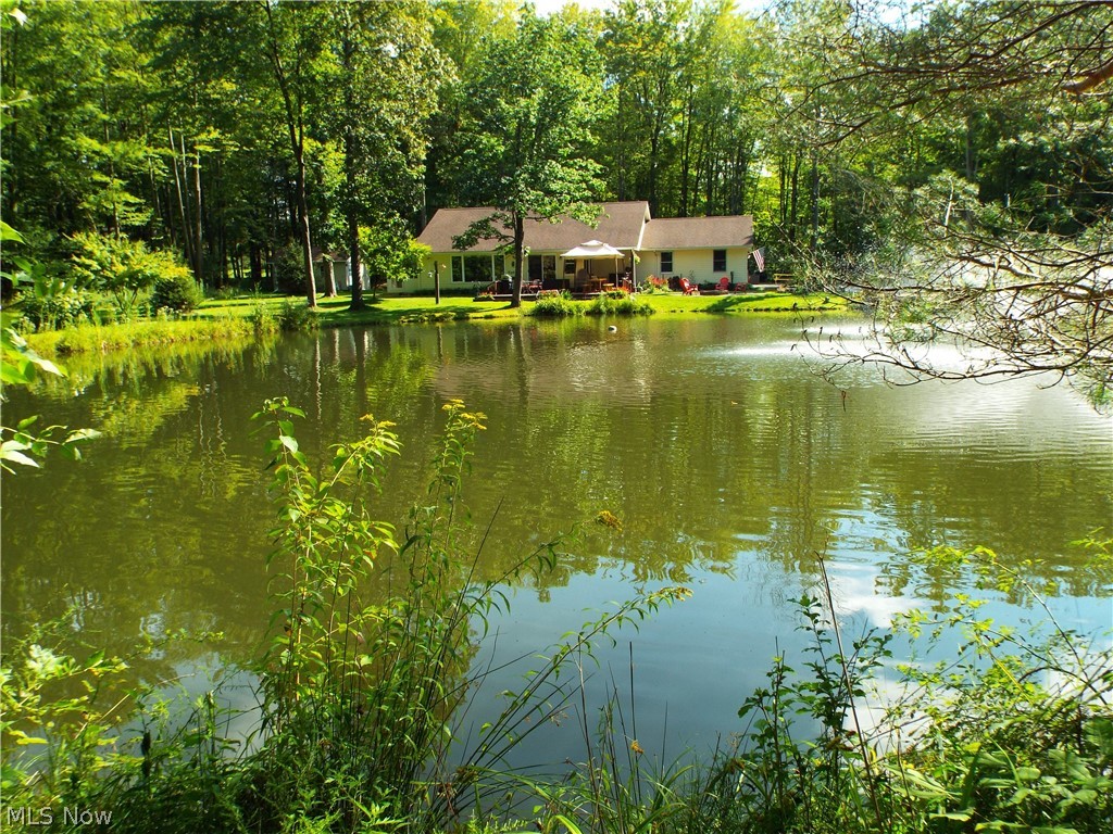Welcome to "Hummingbird Hideaway" - this home has such a lovely setting, even the hummingbirds love it! This well cared for ranch sits on a secluded 5 acre lot in an area of homes with acreage. You will love the privacy of the home, with a cleared section around the house and then woods surrounding you. There is a stocked pond water system that was new in 2016 and serviced in 2022. The open floor plan has plenty of windows to see the scenery all around, there are ceiling fans in every room. A large deck sits in the front with a new enclosed 3 season porch at the back. As a bonus, the home has a 20kw whole house generator. This home is a must see! Please see the attached list of improvements.