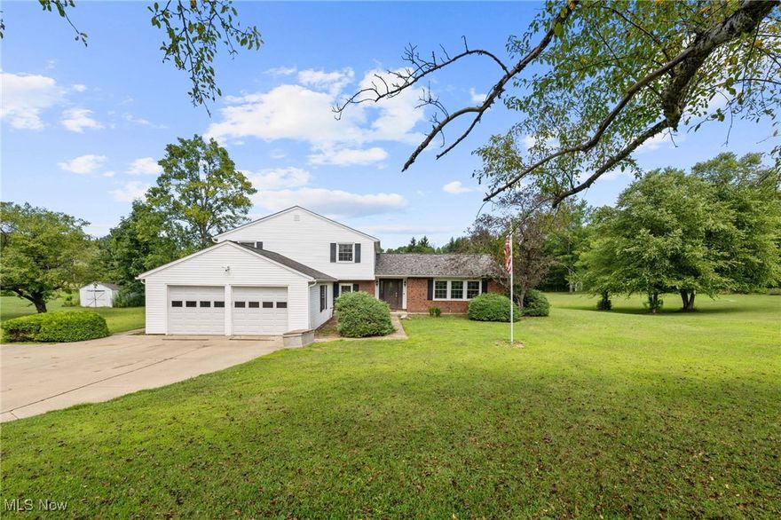 Welcome to this spacious multi-level colonial nestled on 1.5 scenic acres in the heart of Novelty. Located in the highly rated West Geauga School District, this 4-bedroom, 2.5-bath home blends comfort, style, and functionality—perfect for both families and entertainers alike. As you enter, you're greeted by a large, light-filled family room that flows effortlessly into the formal dining area. The kitchen sits just off both rooms and offers picturesque views of the private backyard and peaceful pond. Just beyond, an oversized three-seasons room with a built-in bar provides the perfect space for relaxing or hosting year-round gatherings. A versatile den off the main living area includes a convenient half bath and laundry space—ideal for a home office, playroom, or cozy retreat. Upstairs, you'll find three generously sized bedrooms and two full bathrooms, including a spacious owner’s suite with ample closet space. Recent updates include a new HVAC system, gutters, electrical panel, garage doors, and a roof that’s approximately four years old. The home also features updated appliances, making it truly move-in ready. Enjoy the peace and privacy of country living while still being just minutes from local amenities. Schedule your private tour today and experience the charm and space this beautiful property has to offer!