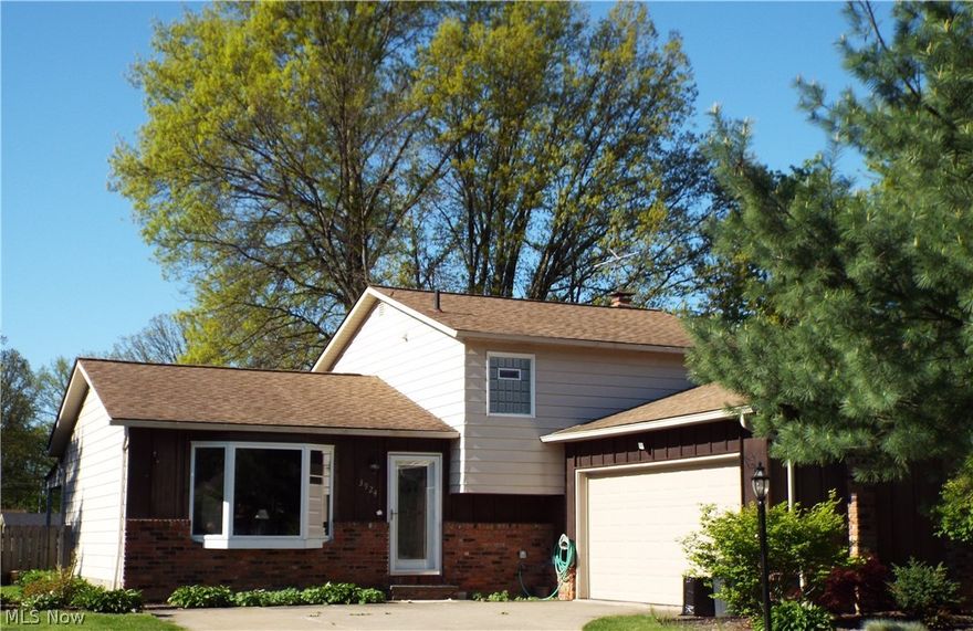 Move in ready!  Beautiful Split Level home with many updates!  Living Room with bay window opens to Dining Room with slider that leads to a covered patio with a decorative garden pond and gorgeous perennials!  The amazing large Kitchen has new granite counter tops and is complete with all appliances!  Kitchen & Dining Room also offer plenty of natural light with sky lights!
Lower level features a Family Room with wood burning fireplace, updated Half Bath and large Laundry Room with washer and dryer included!  Three bedrooms and Full Bath upstairs all have beautiful new laminate flooring!  Full Bath is also newly remodeled! Fenced in back yard! One year home warranty also included! Don't wait! Call today to schedule a private showing!