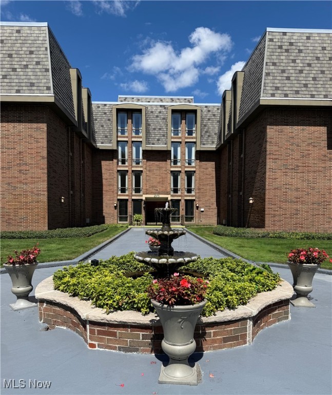 Enjoy one floor luxury living in this fabulous Camelot Condominium situated on beautiful grounds in a peaceful residential setting in Fairlawn Heights. The spacious 2 bedroom condo boasts very large rooms, new carpet, new luxury vinyl flooring, and fresh paint throughout. The bright and cheery kitchen has plenty of cabinet and counter space as well as an area for a dinette table. The formal dining room adjoins the kitchen and living area for easy entertaining. The master bedroom has a walk in closet and wall of windows allowing for plenty of natural light and the second bedroom has a wall of windows and double closets. In the hall connecting the bedrooms there is a built in linen closet with additional drawers for extra storage. The sprawling full bath has a tub and separate walk in shower, double vanity, and ceramic tile floor. A beautiful half bath and laundry room with utility tub complete this wonderful home. This condo comes with 2 assigned parking spots in the secure underground parking garage and a storage unit on the first floor in a secure storage room. In the North building you will find the gorgeous community room which was recently renovated and furnished by Chez Del. The community room offers a sitting area with a cozy fireplace, tables and chairs for dining or playing cards, a sofa and chairs around a wall mounted TV and a full kitchen and prep/serving area for your gatherings. Additional amenities include an indoor heated pool plus a hot tub and doors off the pool area that open to a patio where you can soak up some sun. A parklike area on the back grounds offers a gazebo plus a grill for outdoor cooking, a garden area where you can tend to flowers and plants or just enjoy nature. This condo offers the perfect blend of luxury living, community amenities, and a peaceful neighborhood setting and is ideally located close to Fairlawn and Montrose shopping and dining as well as Sand Run Metro Park, Cuyahoga Valley National Park and the Towpath Trail.
