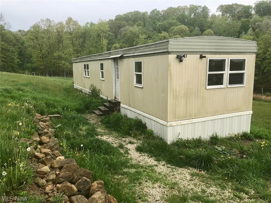 Skyline Mobile Home & 2 Half-Acre Lots - Atwood Lake Area - ABSOLUTE AUCTION, all sells to the highest bidders on location: TUESDAY - JUNE 19, 2018 - 6:00 PM. Skyline 12' x 50' mobile home w/ 2 half-acre lots, year-round or summer getaway. Home features a kitchen w/ stainless steel side-by-side refrigerator, glass-top electric range, chestnut cabinets, double stainless-steel sink, eat-in counter bar, and ceiling fan. Family room w/ wood laminate flooring. Bedroom w/ double closet. Laundry room and full bath. 100-amp breaker electric, sub well, and softener. 12' x 32' wood deck w/ view of countryside. 10'x 12' storage building plus a 10' x 12' lean-to. Immediate possession! TERMS ON REAL ESTATE: 15% down auction day, balance due at closing. A 10% buyer's premium will be added to the highest bid to establish the purchase price, which goes to the seller. Any desired inspections must be made prior to bidding. All information contained herein was derived from sources believed to be correct.