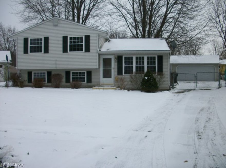 3 bed split level has a complete new bathroom, upgraded tub and features. Updated kitchen includes all new appliances, natural wood floor, new fixtures. Every room is freshly painted, including closets, ceilings, doors, trim. New carpet through out, natural wood floor from front door to kitchen, and second floor landing . All bedrooms have new ceiling fans, and a whole new house fan. The lot is a large pie shape completely fenced, landscaped, mature trees, 2 1/2 attached car garage with opener. Newer vinyl siding and windows.