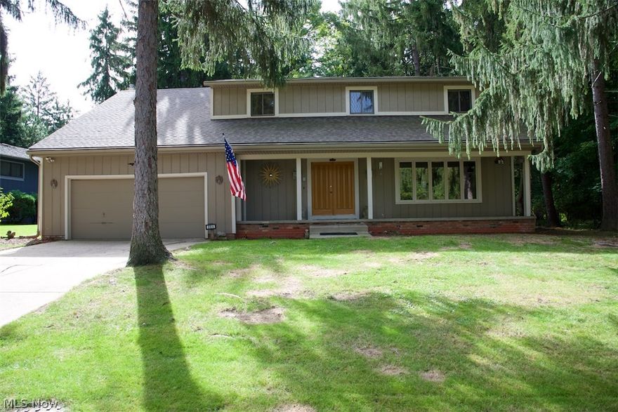 Tranquil, natural setting at this Greenwood Village colonial! Enjoy easy access to the Cuyahoga Valley National Park and all it has to offer right through your backyard, as well as all the Greenwood Village amenities including swimming pool, tennis courts, playground and more! Home features an updated eat-in kitchen with ceramic tile backsplash, newer countertops and fixtures, and island seating. Large family room with wood burning fireplace, and walkout to patio and large two-tiered deck. Formal dining room and living room. Enormous master suite with wood burning fireplace, vaulted ceilings, skylights, slider to private balcony, double closets and master bath. Four additional amply sized bedrooms. Lower level features a wine/fruit cellar, glass block windows, and workshop. Newer ceramic tile, carpet and wood blinds throughout home.  New hot water tank in ’14, window panes replaced in ’13, new roof  and exterior paint in ’09. Both fireplaces feature gas starters. All appliances include