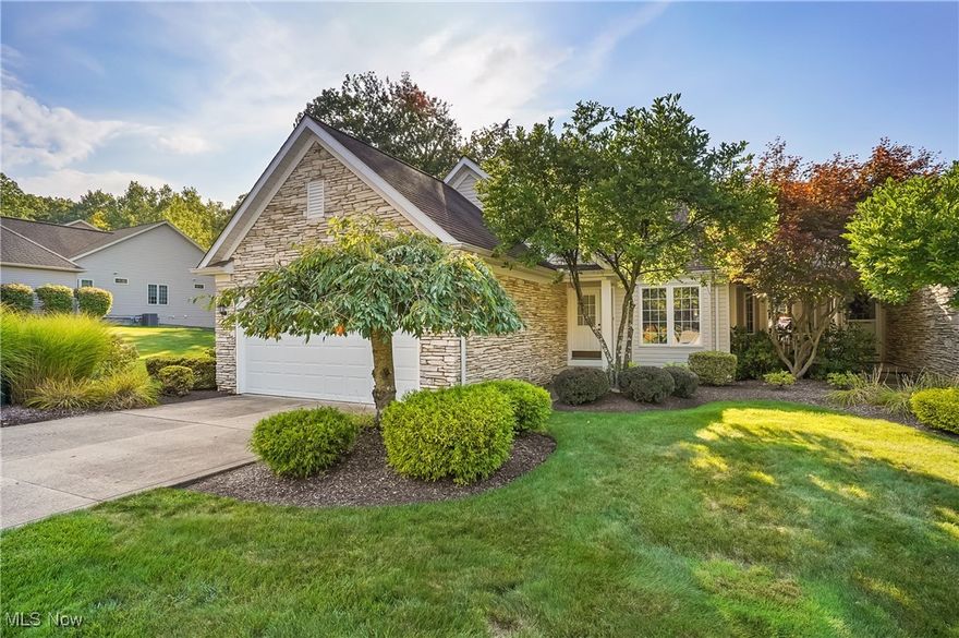 Tucked away in highly sought after Auburn Hills Subdivision, one of Concord Township's most serene neighborhoods, this 3 bdrm, 2 bath ranch condo combines sophistication, comfort, and privacy. Surrounded by mature trees & natural beauty, this residence offers the feel of a private retreat while still being close to the amenities. Step inside through the inviting front entryway & be greeted by the formal dining room, enhanced by hdwd floors & an open sightline into the kitchen. The kitchen is designed to impress with timeless white cabinetry, striking black granite counters, a breakfast bar and a seamless connection to the vaulted great room. Here, soaring ceilings, skylights beaming in natural light, and a beautiful stone fireplace create an airy yet cozy atmosphere. Head out from the great room to the elevated deck, where you can enjoy peaceful views of the rolling wooded surroundings. The primary suite is a luxurious escape featuring vaulted ceilings, private access to the deck, and a spa-inspired glamour bath. Indulge in the soaking tub, enjoy the natural light from the glass block window, or refresh in the separate shower. A double vanity with granite counters adds both elegance and function. Two additional bedrooms provide versatility for family, guests, or a home office, and they share a beautifully appointed full bath with coordinating upscale finishes. The laundry room, conveniently located off the entry, includes cabinetry, shelving, and a utility sink adding thoughtful practicality. The full walk-out basement expands the living space with finished walls, pristine concrete floors, and sliding doors that open to a private patio. Whether envisioned as an entertainment area, fitness studio, or workshop, this space is brimming with potential. Plus a spacious 2-car garage, a meticulously maintained interior, and the tranquility of a quiet wooded setting. This condo offers a rare opportunity to own a luxurious retreat in a coveted location!