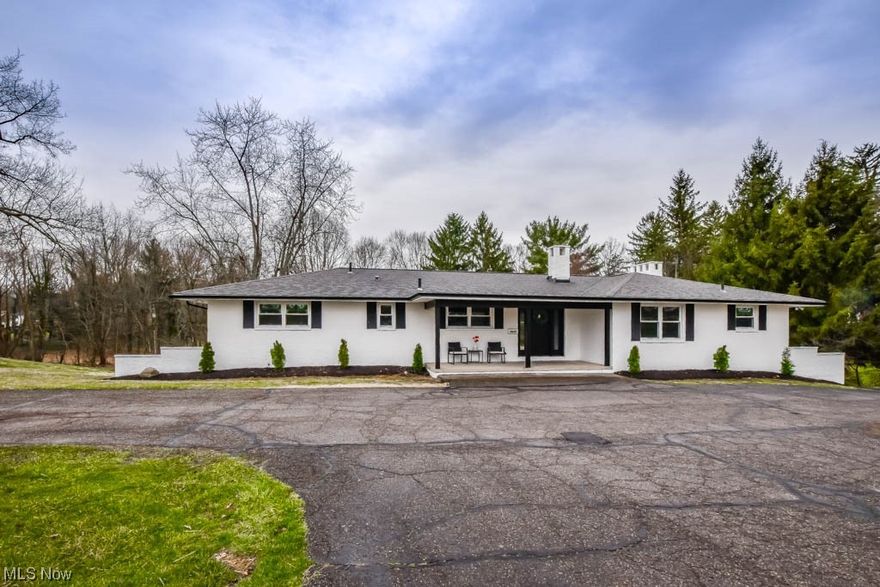 Exceptional brick ranch in iconic Hills And Dales Village with over 3000 sqft of living space and almost an acre of land! Big ticket updates include a new septic, boiler, windows, flooring and more. The sprawling floorplan boasts a stunning dine-in kitchen with full extension dovetail cabinetry, black granite countertops, stainless steel appliances, breakfast bar seating and an adorable coffee bar! An electric fireplace is the focal point in the living room with a huge picture window that lets in tons of natural light.  Down the hall are 4 bedrooms and 2 full baths. The primary bedroom features a private luxury bath with a deep soaking tub, large tiled shower and double sink vanity. The equally impressive main bath is shared by the secondary bedrooms from the hall.  Don't overlook the 1st floor laundry neatly tucked behind sliding barn doors at the foyer entry with a built-in hall tree for coats and shoes. The expansive lower level is fully equipped with a rec room with radiant heated