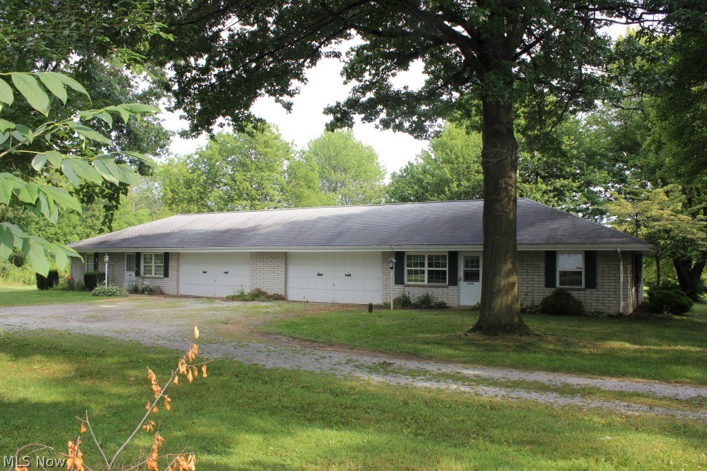 Brick ranch twinplex on private 2.7 acres* Each side having 2 bedrooms, 1 bath, 1020SF, patio and 2 car garage* Same tenant for 17 yrs. paying $550.00 per month* Other side is vacant with new carpet & paint, includes refrig, range, & washer & dryer* Vacant side has central air* Hot water heater 9/2015* Storage building* Softener* Lovely setting*