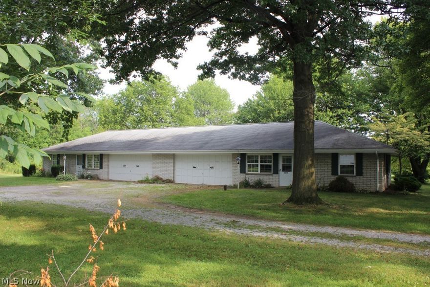 Brick ranch twinplex on private 2.7 acres* Each side having 2 bedrooms, 1 bath, 1020SF, patio and 2 car garage* Same tenant for 17 yrs. paying $550.00 per month* Other side is vacant with new carpet & paint, includes refrig, range, & washer & dryer* Vacant side has central air* Hot water heater 9/2015* Storage building* Softener* Lovely setting*
