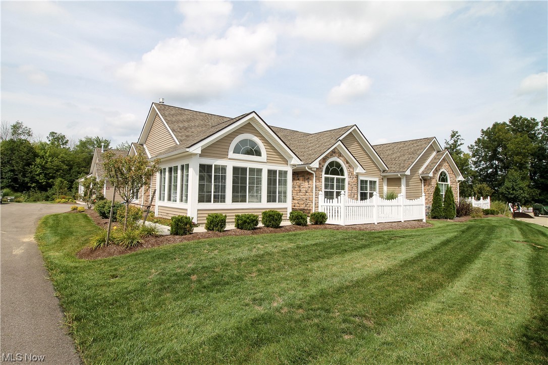 Truly Gorgeous executive sized Condominium was built in 2016 in The Crossings at Golden Pond. This awesome Development features Country Living yet is close to Downtown Kent, Kent KSU Campus and convenient to surrounding suburban communities, including the City of Akron.The Crossings has its own redecorated Club House with recreation, including Workout Room, Inground Pool & Pool Table! Clubhouse can be reserved for family occasions. This Magnificent Condo has way too many upgraded features to mention, including. Beautiful hardwood flooring, Rich cherry stained Kitchen Cabinetry, Granite Counters, Recessed Canned Lighting, Tunnel Skylite, Cutting Edge Glass Subway Backsplash, Subtle Undercounter Lighting & Breathtaking Vaulted Ceilings, The LG Kitchen appliances are like brand new & the Range/Oven is Gas! This Cared for home feaures Fireplaced Living Room with an adjacent Sun Room/Family Room & a spacious Den/Office with, everything, including Bedrooms all on one Level! The Master Bedroo