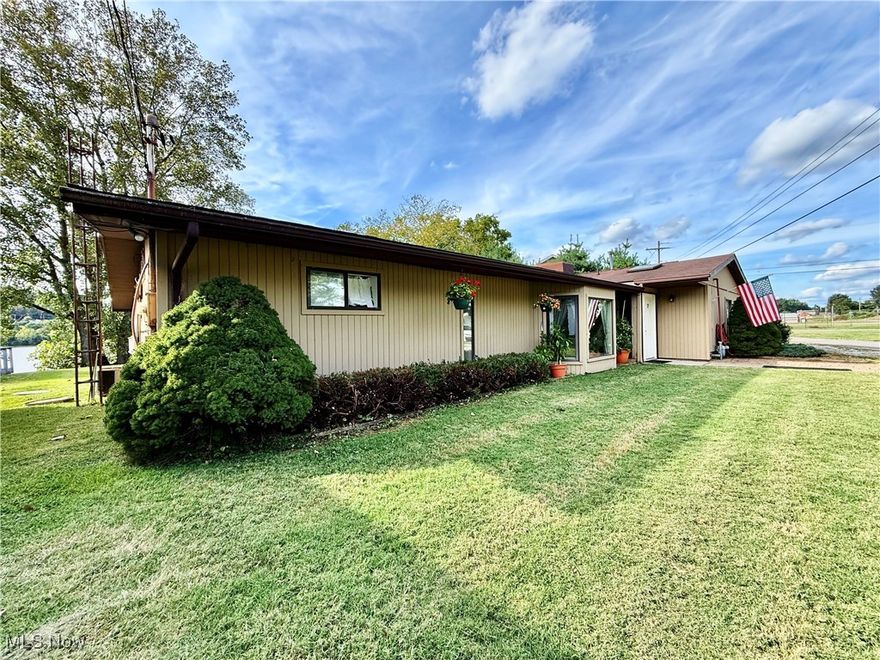 Welcome to your ranch riverfront retreat! This rare offering is a fabulous combination of serene Ohio River views from the back  and golf course vistas from the front. Boasting 3 bedrooms and 2.5 bathrooms, the home features a spacious living room, a cozy family room, an eat-in kitchen, and a large bonus room perfect for a home office, hobby space, or fourth bedroom. The attached garage provides convenience, while the rear patio is the perfect place to soak in stunning sunsets over the river. Located just steps from grocery stores, parks, the library, and more, this property blends scenic living with everyday ease. Whether you're watching boats glide down the river or tee-offs across the fairway, you’ll enjoy the best of both worlds. Don’t miss your opportunity—schedule a tour before it’s gone!