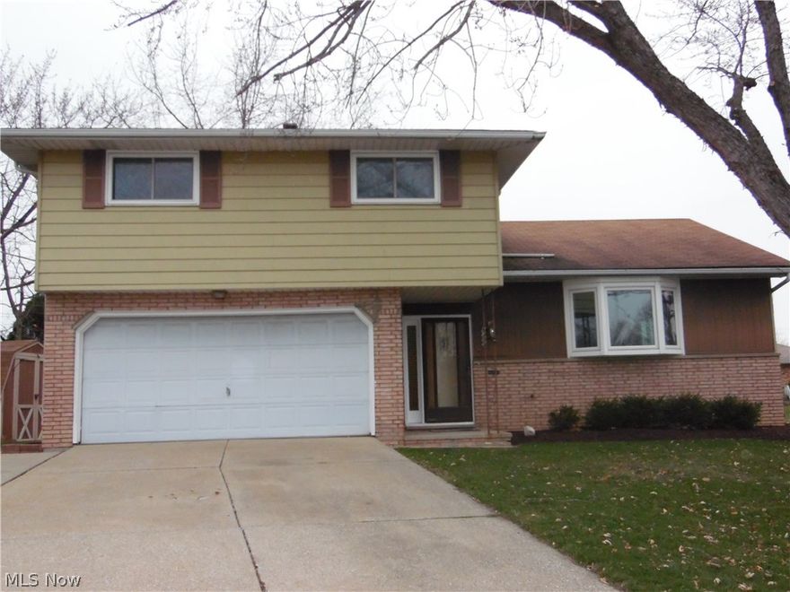 Spacious split level home in quiet neighborhood.  You'll love the open concept main floor where you can see from the living room, at the front of the house, all the way to the back of the house.  The kitchen and dining room are open to the living room making a great entertainment space!  Just a few steps down from the kitchen is the nice-sized great room which is open to the patio and the large yard.  There is also a half bath off the hallway on the main level.  Upstairs are 4 bedrooms with lots of room for beds, dressers, and study/office space.  There are newer Stanek windows throughout the home.  Please contact the listing agent for a private showing.