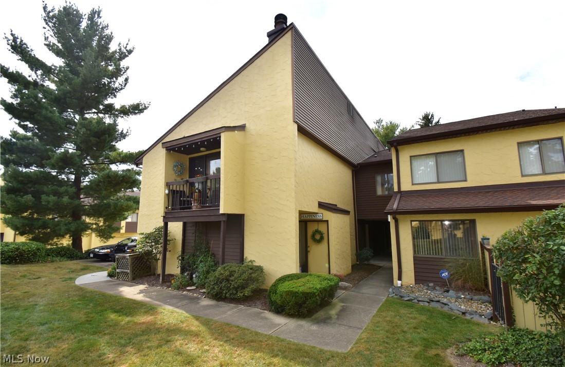 Desirable Hampton Ridge Condo Community! Monthly Condo fee includes cable and high speed internet. This ranch style has all you need for carefree living. Pull into your 2 car garage and enter directly into your new home! Great Room has bamboo flooring, wood burning fireplace, balcony facing the morning sun. You can use one end for formal dining if you like as overhead light fixture is already there. Kitchen has been updated with granite countertops, modern sink faucet, range and refrigerator in 2017. Both bedrooms are bright with large south facing windows. The Master features a walk in closet and private full bath. Laundry room can accommodate full size washers and dryers. Nearby pool and tennis courts. Surrounding area with the Sieberling Nature Realm and Sand Run for walking, and so much shopping within a few miles from Summit Mall to Montrose. Seller is providing a 1 year home warranty by America's Preferred. You'll want to schedule an appointment quickly before this one is gone!