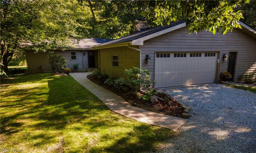 Beautiful sprawling completely updated ranch from top to bottom  w/open floor plan tucked back on a private wooded 5.2 acre lot with huge two story 65X 40 barn.  This gorgeous home features a vaulted great room open to the brand new kitchen with granite /Viking gas stove and all stainless appliances. Washer and dryer included.  All refinished natural hardwood floors. Large dining room open to living room with wood burning fireplace.  Huge private vaulted master bedroom with double closets and gorgeous completely gutted and remodeled private master bath.  The other 3 bedrooms all have natural hardwood floors fresh paint. All new doors, windows,roof, furnace,air conditioning, fresh paint, fixtures, all baths remodeled. Everything has been updated. Passing septic system from Geauga County Health district and waterproofed basement with transferable warranty.  New front walkway and landscaping! Nothing to do but move in and enjoy. 5 minutes to 422. Kenston schools. Seller is a Licenced Real