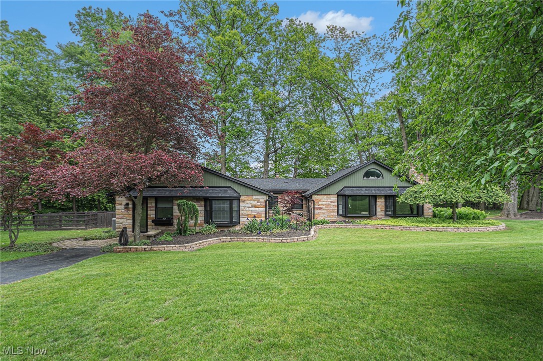 One of a kind cape style home has been meticulously maintained both inside and out! The Frank Lloyd inspired aerie rests on just under 7 acres on the hillside overlooking part of tinkers creek & metro parks. Plenty of room for your own private gardening & mini farm, horses…possibilities are endless. Upon entering the large foyer area the abundance of natural light from the 2 large bay windows floods the huge living room & its gleaming wood floors with coffered ceiling & wbfp. The beautiful kitchen has natural cobblestone flooring, and it's very own FP with renovations which include new backsplash, quartz countertops, newer appliances, plumbing, along with updates to the cabinetry. The kitchen is open to the welcoming sunroom/family room which was recently gutted & fully redone with half inch tongue and groove- overlooking the hillside & also leads to outbuildings & acreage. Easy access to laundry room off kitchen. Spacious Master suite with vaulted ceiling & private bath. Upper dormer holds the second bedroom suite with easy access to the fully renovated second full bath. Mammoth size mudroom offers potential for 3rd bedroom & leads to the serene outdoors which hold the newer 2 1/2 car garage, the amazing must see “she shed”, & additional storage sheds.
Nine hundred sq feet of decking on the hillside holds a beautiful screen porch, (which was recently redone-all wood & screens), gazebo & plenty of seating area overlooking the creek below. Screens have been recently replaced on all the Anderson Windows throughout the home. Additional Updates include newer roofs on every structure 2022, HVAC 2018. Water tank 2020. Looking for that quiet evening to unwind? Rest in your very own serene oasis with private pond & waterfall overlooking nature to soothe the soul. Perhaps you feel like a party this weekend...plenty of room to entertain... this Home has it all. It's a Must See ! Access to Walton Hills swim club paid through 2025. Call today for your private showing.