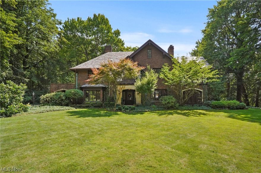 Architecturally impressive, this spectacular sprawling estate on 2.5 acres designed by renown Akron architect Roy Firestone and built by Krimroy Construction presents impeccable craftsmanship and brilliant appointments throughout.  Awe-inspiring updates were created by the current owner who has personally designed most of the interior of the home with her keen eye in design. She has transformed spaces including a full kitchen remodel, butlers pantry, fireplace mantel surround w/cherubs, wallpaper and paint color pallets, and furnishings.  The gracious foyer, with an open two story staircase, is flanked by the formal living room w/fireplace and the dining room w/access to side covered portico.  State of the art kitchen showcases marble counters, SS appliances, new cabinetry/floors, and much more. Adjacent breakfast rm. The Sun Room wraps around the back of  home and flows into the family room that offers fabulous views of vistas beyond.  Arched French doors accent living spaces. The pri