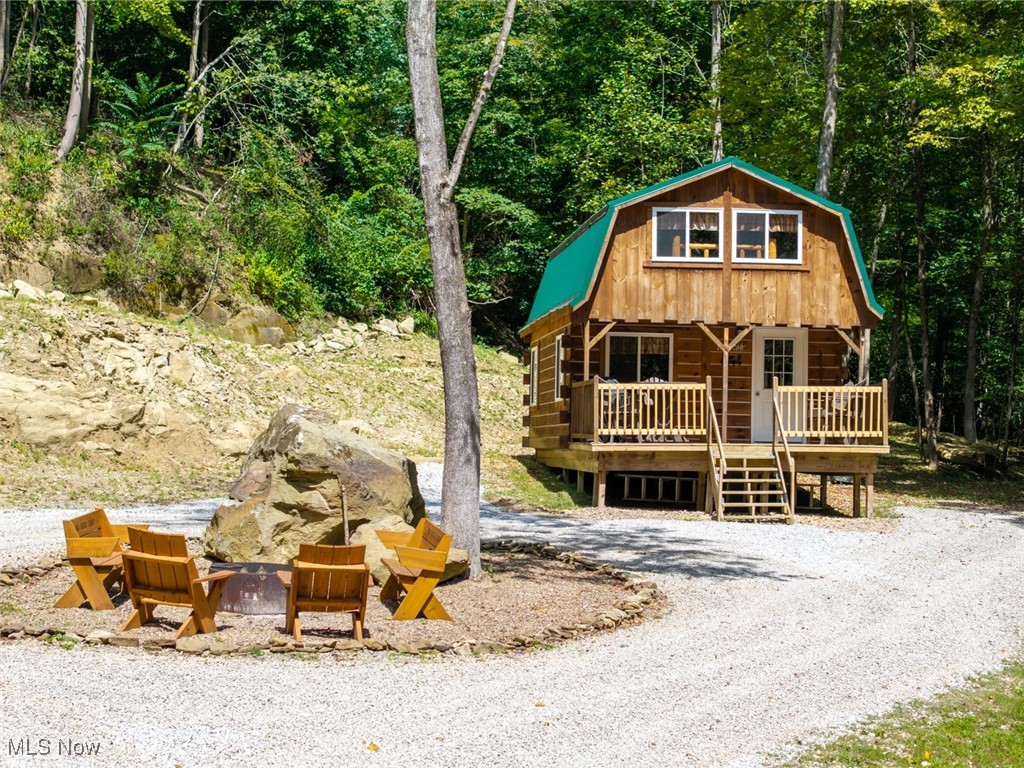 The ultimate weekend getaway awaits in Muskingum County!
This 1-bedroom, 1-bath off-grid cabin on 5 pristine acres is just 2 miles from The Wilds and a quick 5-minute drive to Blue Rock State Park. Surrounded by thousands of acres of public hunting, plus endless opportunities for canoeing, fishing, hiking, and more, this is the perfect retreat to unplug and enjoy the outdoors. Meticulous care has gone into making this property turn-key and ready to use immediately.
Property features include:
960 sq ft cabin with 12x16 deck
1 bedroom / 1 bathroom (compost toilet)
Off-grid setup with electric via portable power station or generator
Wood stove for heat
Cabin insulated underneath
beautiful walking trails
incredible rock outcroppings
New gravel on the driveway
Selling mostly furnished
Annual taxes are approximately 1224.