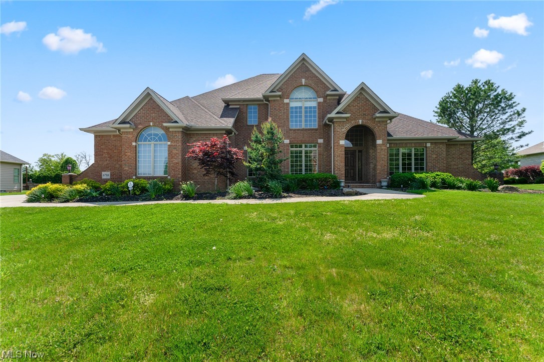 You'll absolutely fall in love with this amazing, rehabbed house in one of the most desired neighborhoods in Canfield located the 17th hole of Kensington Golf Course! This massive, brick 2 story house offers over 3600+ sq ft with 4 bedrooms, 3 bathrooms and modern updates that will make you fall in love! The breathtaking kitchen will wow you immediately with the gold veining granite countertops, white subway backsplash, up to the ceiling white shaker cabinets with tons of storage and gold hardware, open shelving and an island perfect for gathering! All new stainless appliances and mini fridge. Walk in pantry and eat in area near the access to the back stone patio with views of the golf course. The great room offers a redesigned fireplace with beautiful tile and a wall of windows offering tons of natural light. New LVT flooring. Home office located near the front with custom built ins. Formal Dining room with lighted tray ceilings. The master suite welcomes you into a private oasis with