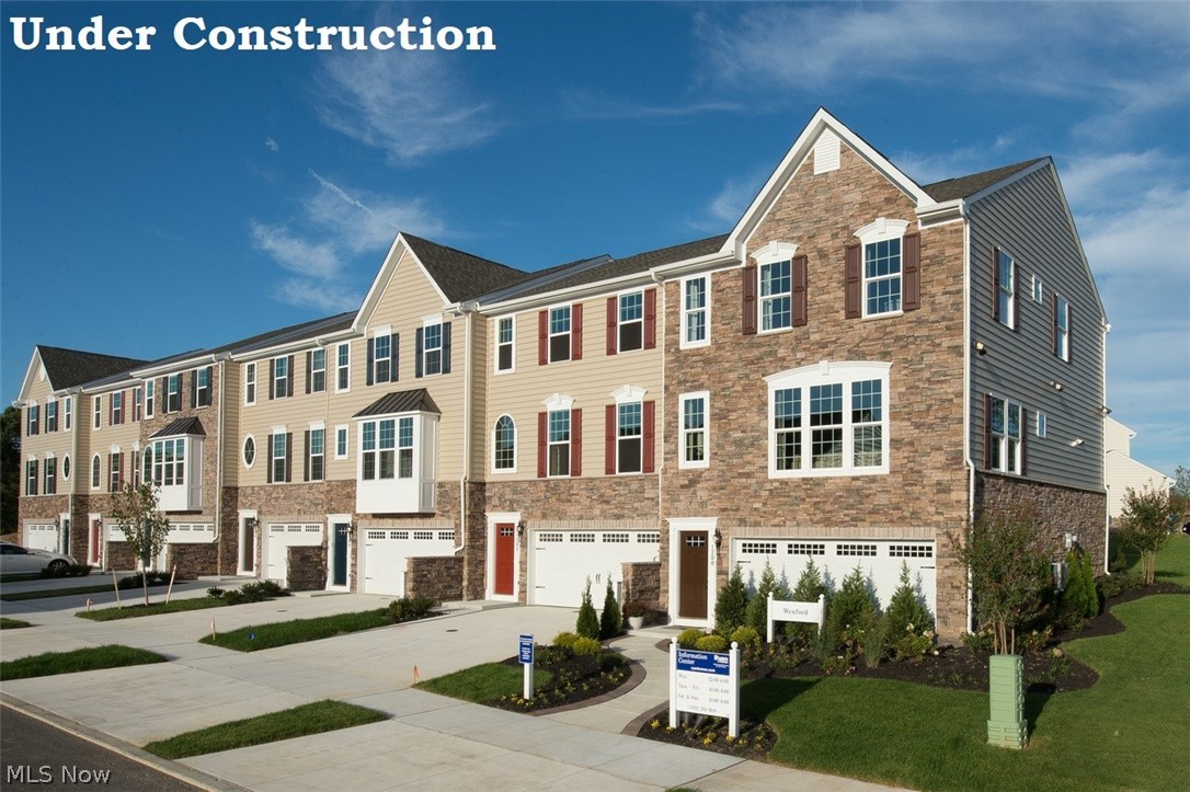 Whether you're looking for your first home or want brand new everything, you can find it at Towns at Steels Corners in Northern Cuyahoga Falls! Plus, with landscaping installed and lawn and snow care provided, spend more time doing the fun things in life and less of the work! Build your dream home in this easily accessible community with tree-lined and open space views set along a single cul-de-sac street! Plus, area shopping, restaurants, and recreation are conveniently close by! The Wexford townhome floorplan with open-concept main level provides a modern multi-level layout that adds excitement to daily living! An oversized kitchen island creates the perfect command center for cocktails and snacks, meal prep, or getting a little work out of the way! Upstairs you will find 3 bedrooms and the convenient laundry area. Your owner's suite has been outfitted for luxury with a wardrobe-sized walk-in closet and dual vanity en suite! You'll also love the extra storage in the lower level and 2