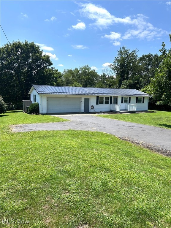 You don't want to miss this adorable 3 bedroom, 1 bathroom home that blends comfort and functionality. This property is situated on a 0.46 acre lot that is located in East Muskingum School District with easy access to U.S. Route 40 and I-70. This home offers a 2 car garage as well as a cozy layout ideal for everyday living, with a carpeted living room leading to the 3 bedrooms that all contain ceiling fans. There is plenty of natural light throughout the home. Enjoy the beautiful backyard perfect for weekend barbecues, gardening, or playtime. You can also have a relaxing evening on the covered back deck.
Updates to the home include: kitchen and bathroom flooring, drainage added around perimeter of the home, metal roof (2020), spacious walk-in shower, two Mitsubishi wall air conditioning units, well pressure tank, garage door opener, and gutter guards.