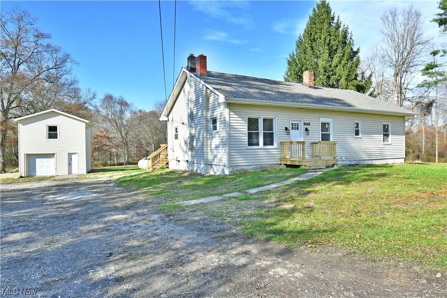 With almost thirteen available acres found on its scenic wooden lot, this impressively spacious Fowler home offers great views both inside and out! Boasting a resounding five-bedroom layout plus a full basement, this residence has just what you’ve been looking for and more. A winding drive leads up to the recently renovated and move-in-ready home while a detached garage enjoys a full overhead loft for easy storage, converted living space or room for entertainment. Through the front door, a carpeted staircase rises away to find the pair of second floor bedrooms to include an expansive bedroom with an additional den space that divides the pair. Meanwhile, the first floor continues through the fireplace laden living room while recessed lighting shines down from above. The striking kitchen sits around the corner with its beautiful melding of stainless appliances and dark colored cabinets. Formal dining looks on as it bridges the rear hall where hidden laundry is located. An oversized master bedroom includes its own full private bath with must-see tile and stonework. The like styled second full bath joins the remaining two bedrooms with its like styled shower and marbled vanity.