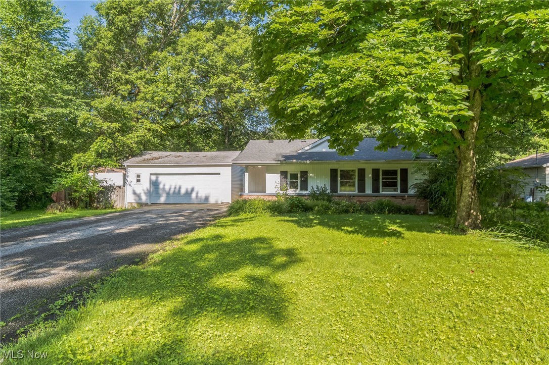 Enjoy single-floor living in this spacious ranch home, set on a private, half-acre wooded lot in the village of Reminderville. This 4-bedroom, 2-bathroom home offers ample living space, including two living areas and an updated eat-in kitchen with granite countertops. Located in an award-winning school district, it's an ideal setting for comfort and growth.
Inside, you'll find a large foyer, natural woodwork throughout, and a vaulted-ceiling living room with a wood-burning fireplace. Step outside to a large back deck overlooking a peaceful, landscaped yard that provides privacy and a connection to nature.
For added peace of mind, the sellers are installing a brand-new roof - one less thing for buyers to worry about! Ranch homes like this are in high demand, so make sure to schedule your showing today!
