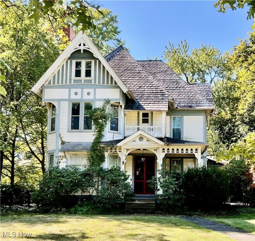Step into this beautifully preserved and remodeled (1995)  Victorian home, offering the perfect blend of original historic charm and modern living.  From the moment you enter the spacious foyer you’ll be captivated by the warmth of wood floors, elegant details and inviting natural light throughout. 

The main level features a gracious living room with a fireplace, a large formal dining room with bow windows, a cozy library and a family room with real beamed ceilings and a second fireplace.  The updated kitchen offers a comfortable breakfast area, ideal for casual dining, while the private office with its own full bathroom provides flexibility for work or guests.

Upstairs, the picturesque staircase leads to four bedrooms including a spacious master suite with a private bath.  The home also offers four full baths and one half bath, a screened rear porch for relaxing, and a walk-up attic for additional storage or creative space. 

Outside, enjoy the stately presence of an amazing two-story brick carriage house and a three-car heated garage—-all set on over two-thirds of an acre.

This exceptional property combines historic elegance with today’s comforts —-a rare opportunity to own a true Victorian treasure.