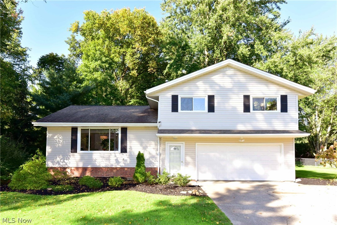 Prepare to be Moved!...Into this gorgeous updated split level home in Brecksville! CLICK "VIRTUAL TOUR" LINK TO VIEW 3-D TOUR NOW! You'll fall in love with the open floor plan on the main level with beautiful oak hardwood floors throughout the Living Room, Dining Room & Kitchen. Freshly painted in today's neutral colors! Remodeled kitchen features Quartz Countertops, Kraftmaid kitchen cabinets, L-shaped island, new dishwasher and beautiful tile detailing. Newer sliding doors (2017) lead from the Dining Room out to the oversized deck with DeckOver treatment! Updated half bath completes the main level. The upper level offers the Master and two additional bedrooms with ceiling fans that share the spacious updated bath with tile walls and flooring, new toilet, vanity, dual sink, tub/shower, and lighting. (2018) Lower level features family room and utility room with glass block windows and screened vents. Additional updates include new roof (2012), coordinated door hardware, light switches