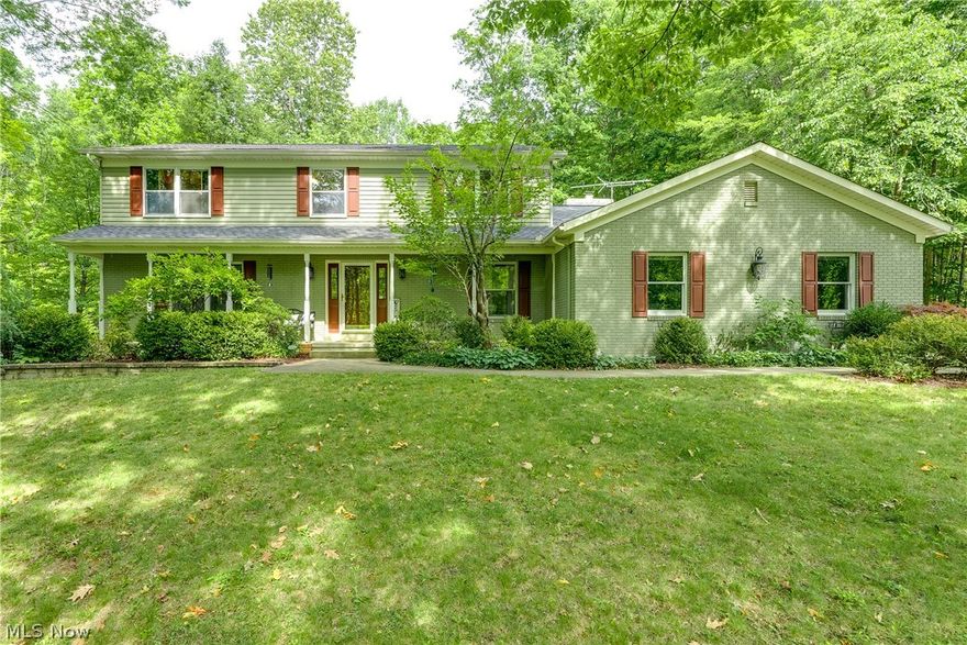 Welcome in to this beautiful 4 bed/2.5 bath colonial nestled on a private wooded lot in the highly sought after Reserve
of Medina. This gracious home offers 2744 sq ft of above ground living space, the front foyer and stairwell greet you as you enter the
home. Off the foyer you will find a dedicated office space, a 1st floor 1/2 bath, & a large living area that works great
as a flex space. Walk through the front living area & you'll find a huge dining room that will fit everyone for gatherings plus some! A hallway off the dining room leads back to the foyer and into the kitchen. The 22'x13' Eat in Kitchen has updated two tone cabinetry, upgraded sink, plus a refrigerator, newer dishwasher, stovetop and built in double ovens that stay with the home. The kitchen area includes a casual dining area and sliding doors that lead to the huge 3 season room out back. Adjoining the kitchen area is the extra large 23'x15' family room w/ fireplace & built-ins that include a hidden wet bar cabine