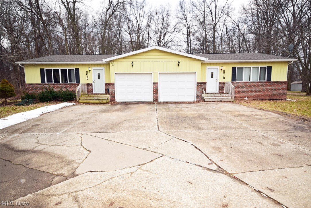 Great investment opportunity! Live in one side and rent the other or rent out both! Left side unit has open concept living room and kitchen. This home has some major improvements including newer roof, water proofed basements, and newer appliances. Basements have high ceilings and can be finished for additional living space. Scenic wooded lot and large master bedrooms with sliding doors to the back yard make this a must see! Individual garages and lots of additional parking area! No worries as it comes with America's Preferred Home Warranty! Call TODAY to schedule your private tour! This won't last long!