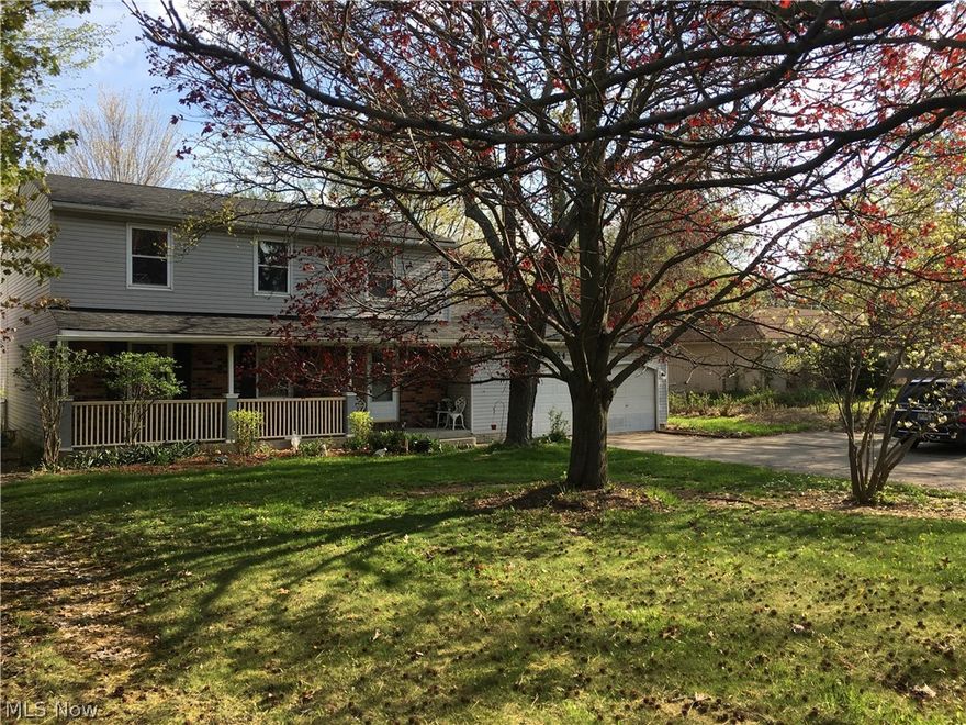 Large vinyl sided colonial situated on 1.2 acres right in the heart of Strongsville.  Set back off street and tucked away with mature landscape.  Ample parking with turnaround drive.  Covered front porch and large deck off the kitchen allow you to enjoy the extra large lot.  Originally a 1700 sq ft floorpan, this home had an addition put on and home is closer to 2700 sq ft now!  Generous bedrooms sizes give options for two separate master bedrooms up.  Two bedrooms offer private bathrooms and skylights overlooking the rear yard.  Full partially finished basement offers additional options.  New roof and hot water tank ’16.  Good luck finding this rare combination of square feet and acreage at this price.  Bring your decorating ideas and make this one yours!