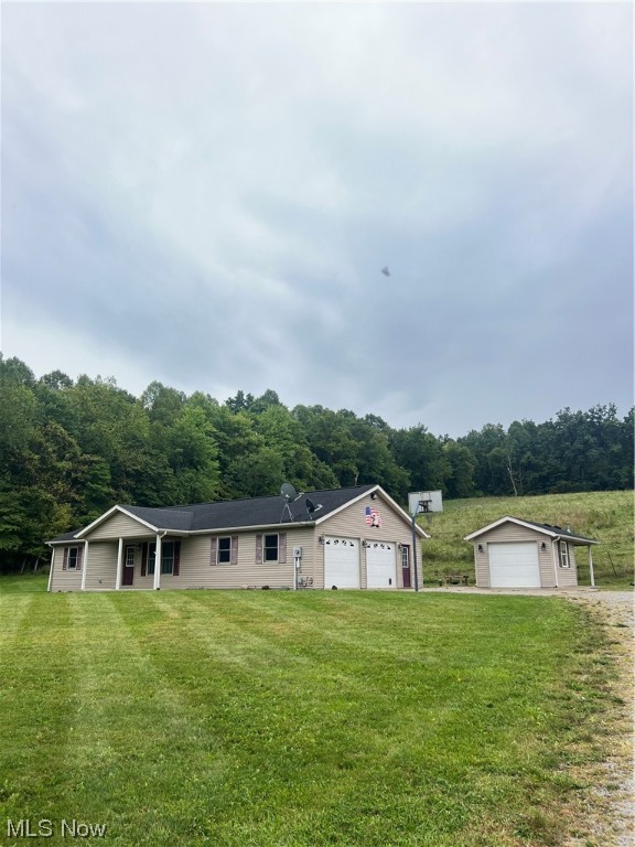 Are you looking for an affordable - country living home in Holmes County?! Very nice Ranch home with 1 Acre just west of Millersburg and minutes to Holmesville. The home offers 2 bedrooms a guest bedroom - a Master bedroom and bathroom , and a 2nd bathroom, Spacious eat- in- kitchen with lots of beautiful oak cabinetry and living room. Large utility room, all appliances stay. Nice concreted crawl space with forced electric heating and Central Air, 2 car attached garage (heated) and a detached garage with a pavilion attached that is all concreted and great to entertain! Would make a great he or she-shed or even insulate for another retreat stay!! Covered front and back porch with country scenery from all sides. Makes this your next home or great vacation get-away in Amish Country! Call today for a private tour. Immediate Possession