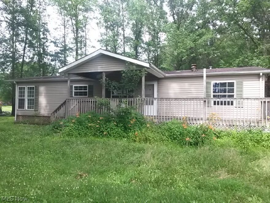 Nestled on over four acres this home offers  large great room with fireplace, dining room and spacious kitchen with plenty of cabinet space.  Large master bedroom and master bath with large soaking tub.  Two other bedrooms offer spacious areas for children rooms.  Large front porch allows you to enjoy a relaxing evening overlooking the pond.  Call today to make an appointment to view this home.