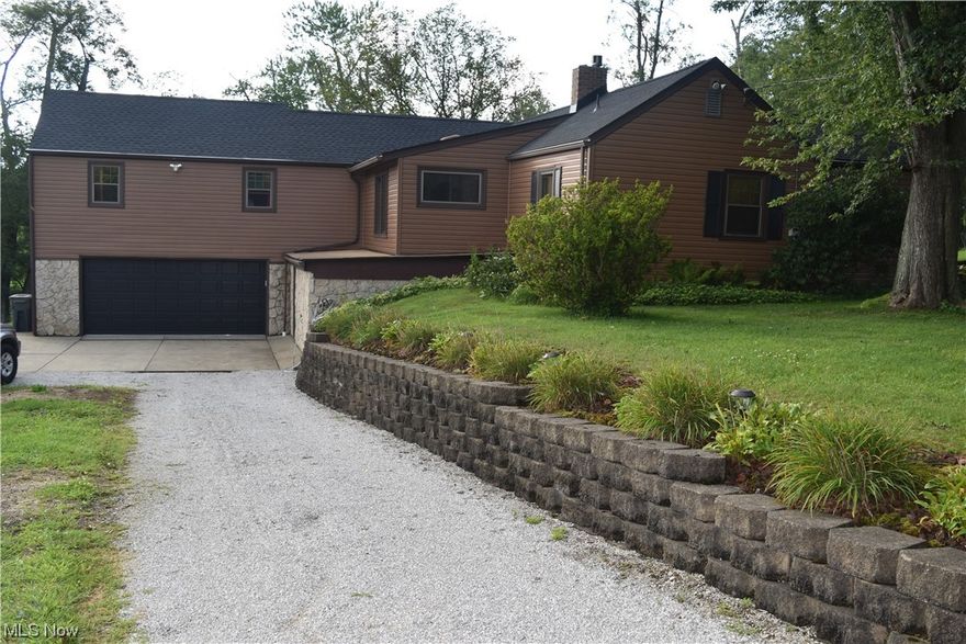 As you drive up to this stunning ranch home you will be greeted by the beautiful extensive landscaping and alluring 5 acres of land with a pond and a large Morton style pole barn for additional storage. Enjoy all the country views while you relax on the lovely rear deck. As you walk into the very inviting home, you will see the delightful kitchen that has stylish white cabinets with Corian style countertops, a nice size pantry, and gorgeous wood beams. The formal living room has a charming stone gas log fireplace to cozy up to and the first floor family room also has a wood burning fireplace and a vaulted ceiling with wood beams. The master suite is more than you can dream of with a stone gas log fireplace that you can sit by while reading a book on a cold winter night, it also has a cathedral ceiling, and a master bath. There is a first floor laundry room to make doing laundry convenient. Vast amount of storage and closet space. The fourth bedroom is located in the basement along with a nice workshop area. Newer shingles were installed around June of 2023,the home has replacement windows, and leaf guard on all gutters. The home is located about 15 minutes to Bridgeport or St. Clairsville. Call to see this remarkable home before it's gone.